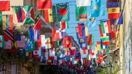 A wall with many flags